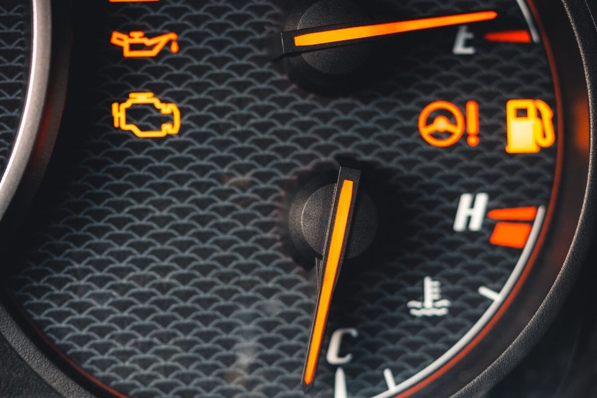 Car dashboard with warning lights illuminated