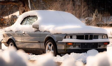 Vehicle covered in snow during cold winter weather