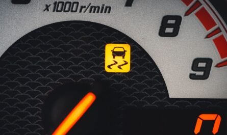 Car dashboard showing an illuminated warning light