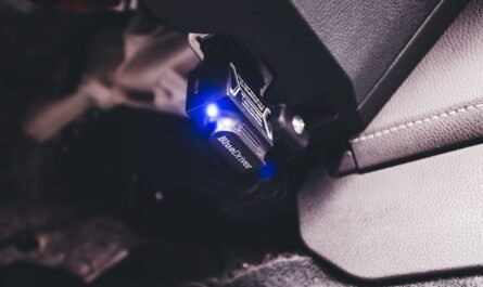 Bluetooth code reader diagnostic tool connected inside a vehicle
