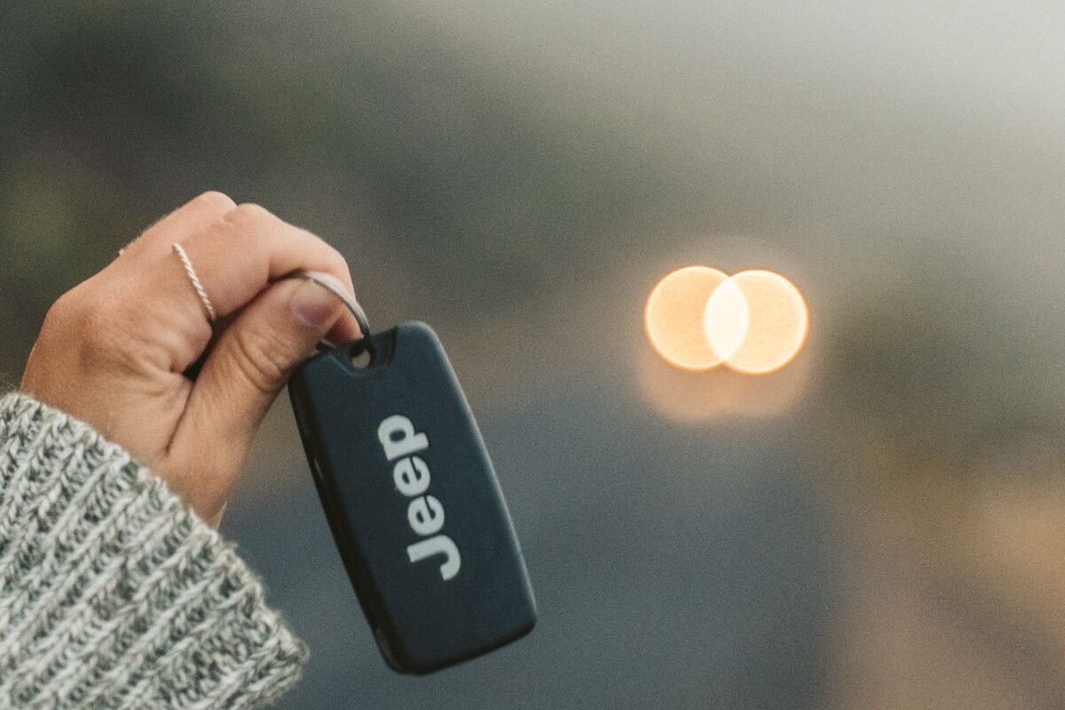 Hand holding a car key fob