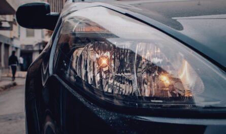 Close-up of a vehicle headlight on a street
