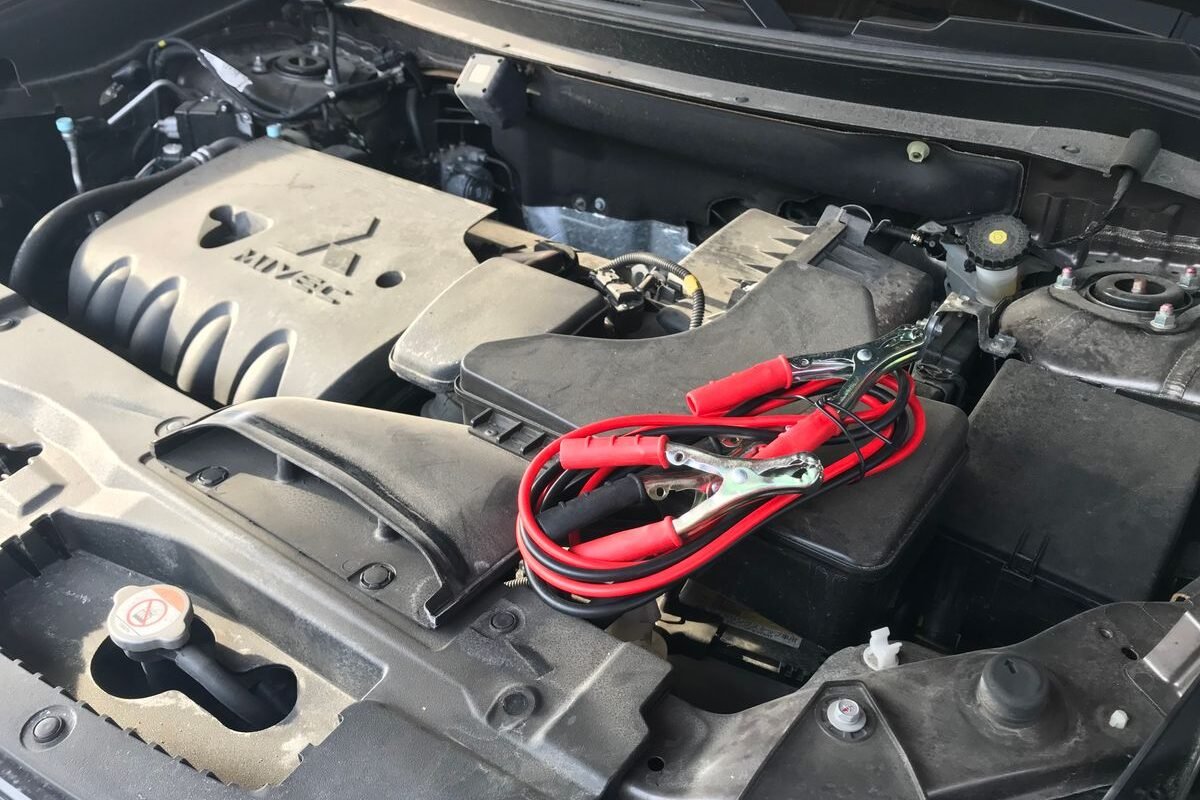 Car engine with jumper cables attached