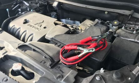 Car engine with jumper cables attached