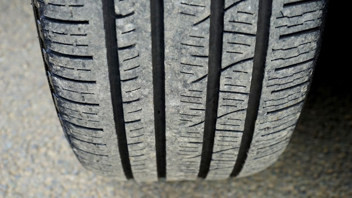 Macro shot of a worn tyre tread showing wear pattern