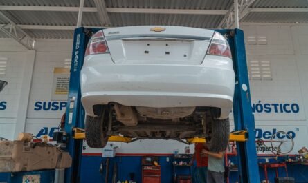 Vehicle lifted for maintenance in a repair shop