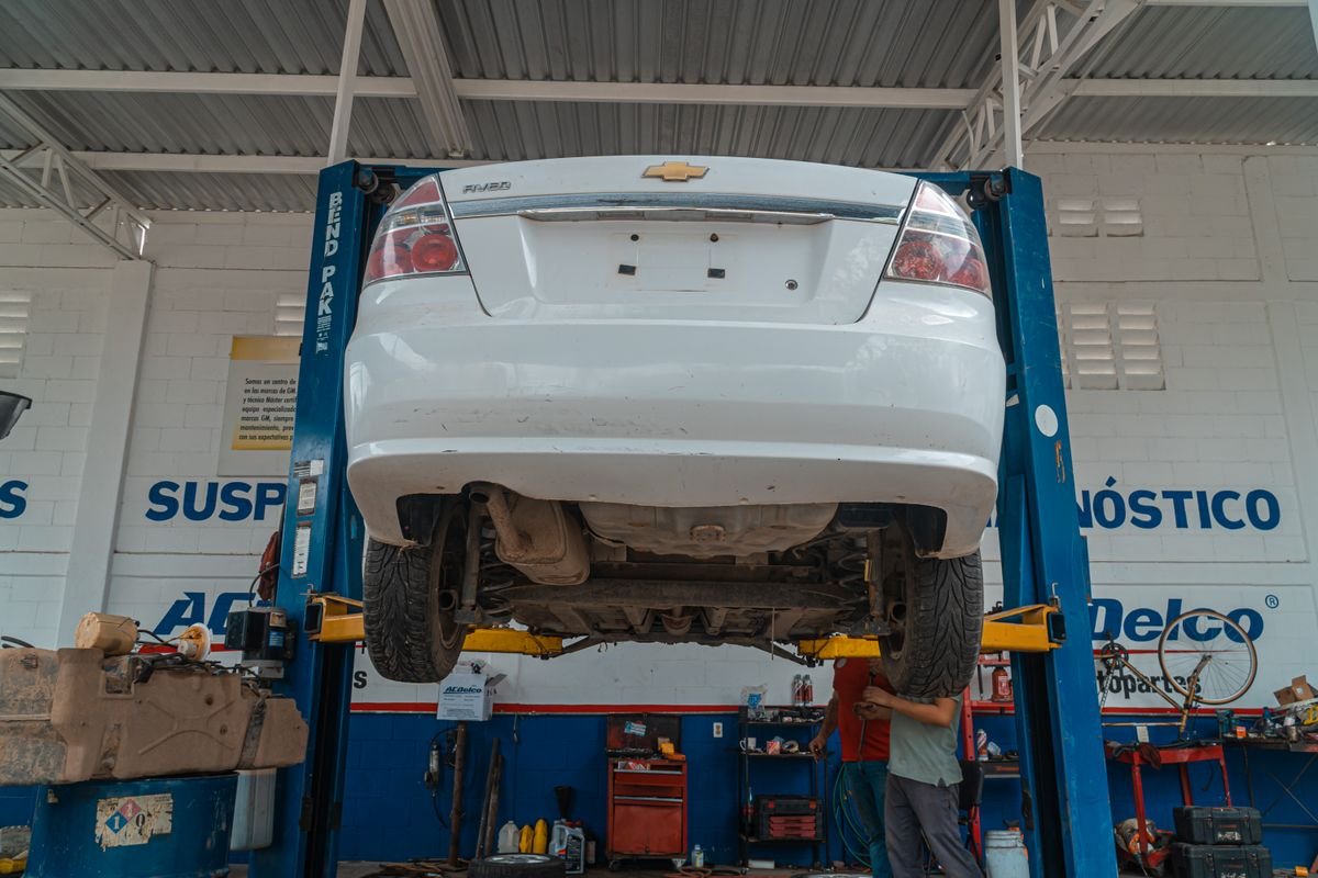 Vehicle lifted for maintenance in a repair shop