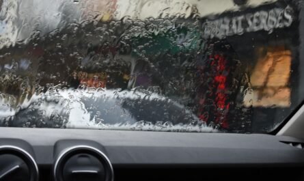 Rain-covered van windscreen with wipers