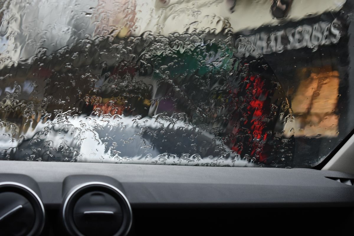 Rain-covered van windscreen with wipers